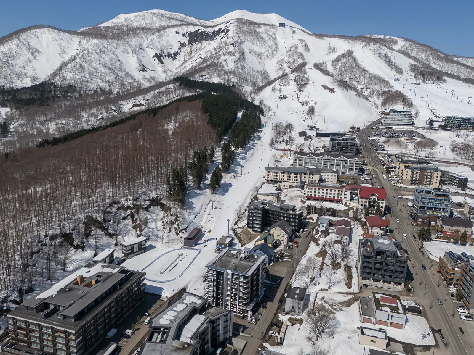 Aerial view of Hirafu village and the Grand Hirafu ski runs in Niseko